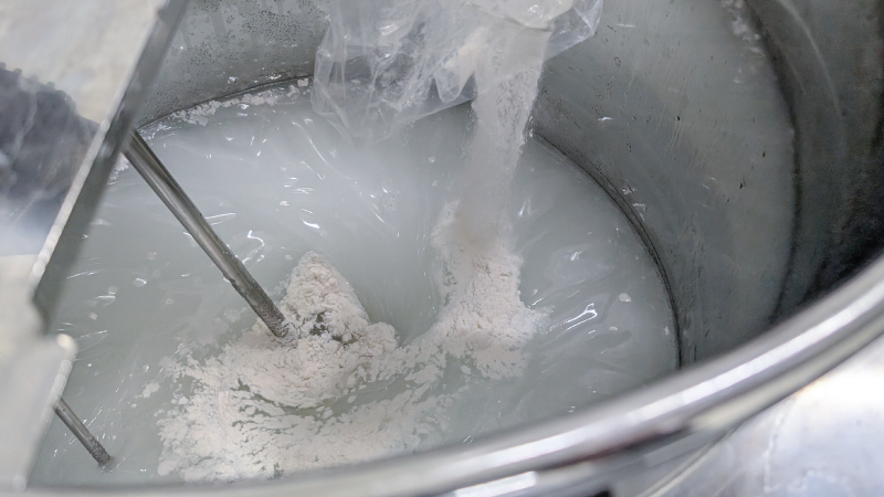 Mixing raw materials inside the temperature-controlled tank